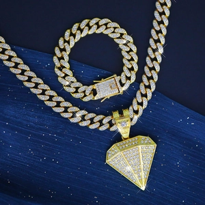 Luxurious gold iced out Cuban link necklace and bracelet set with diamond shape pendant