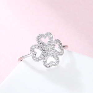 Sparkling 925 sterling silver four leaf clover ring with heart details and white zircons
