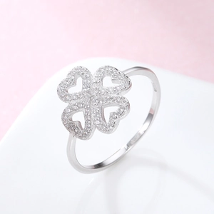 Macro detail of 925 silver four-leaf clover ring with sparkling pave cubic zirconia