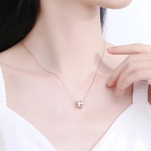 Elegant rose gold S925 sterling silver cylinder necklace with pave diamonds on model