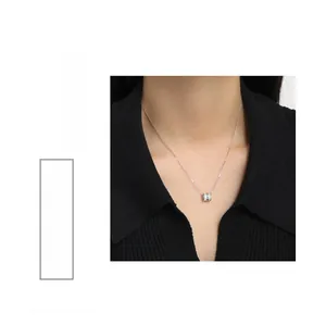 Close-up of S925 sterling silver cylinder pendant necklace with pave-set shimmering crystals