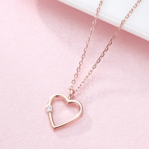 Elegant rose gold hollow heart necklace with minimalist CZ stone pendant for women
