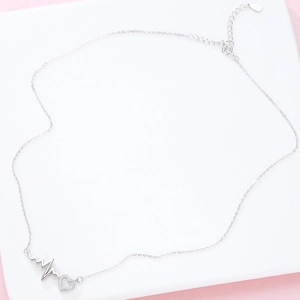 Close-up of S925 silver heartbeat necklace with pavé zircon heart pendant detail