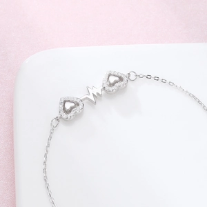 S925 sterling silver heartbeat bracelet with sparkling double heart charms for women