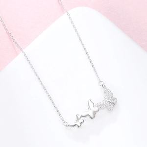 Elegant S925 sterling silver butterfly necklace with sparkling zircon pavé on pink background