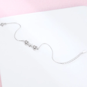 Macro detail of S925 sterling silver heart bracelet with zircon stones and heartbeat design