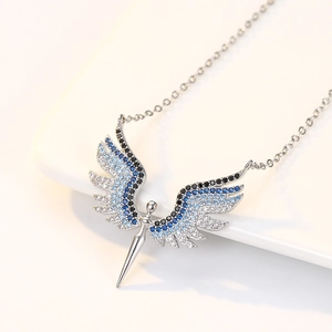 Detail of S925 silver angel wing necklace with blue gradient cubic zirconia stones