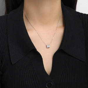 Elegant S925 sterling silver cylinder necklace with sparkling pavé crystals worn by a model