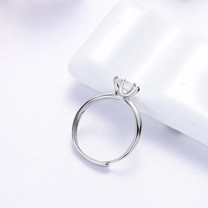 Detail of s925 sterling silver ring with six-prong crown setting and moissanite stone