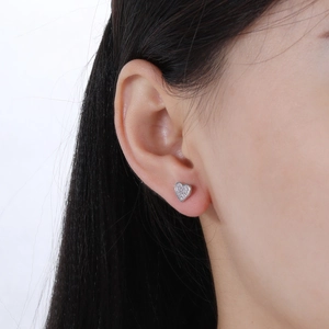 Elegant S925 sterling silver heart stud earrings with sparkling pavé diamonds on model