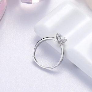 Macro detail of S925 silver snowflake ring with crown-set moissanite stone