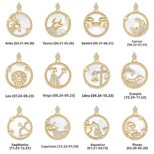 Collection of twelve zodiac pendants in gold finish with white shell and crystals