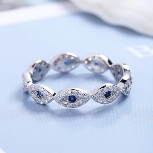 Macro shot of S925 sterling silver evil eye ring with blue stone and micro pavé crystals