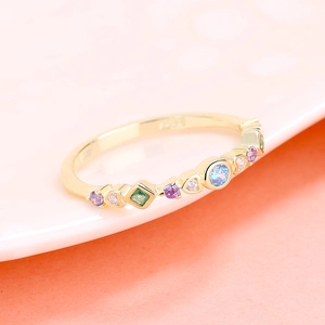 Macro view of S925 sterling silver ring with colorful gemstones and engraved mark