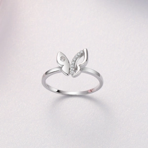 Macro view of S925 sterling silver butterfly ring with clear hallmark and sparkling zircons