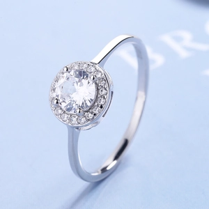 Macro view of a classic S925 silver round cut halo diamond ring with sparkling details