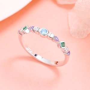 Macro view of S925 sterling silver ring showing colorful gemstones and hallmark stamp