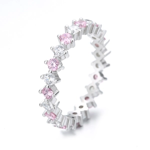 Eternity ring in S925 sterling silver with round-cut pink and white stones at 45-degree angle