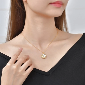S925 sterling silver zodiac shell pendant necklace worn by model on black V-neck top