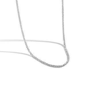 Macro detail of S925 sterling silver sparkling chain with star-cut texture and light reflection