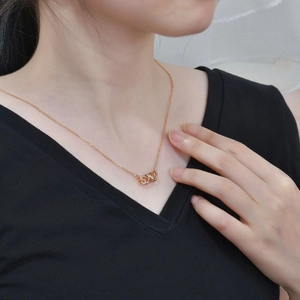 Rose gold 925 sterling silver 520 necklace with sparkling zircons on female model