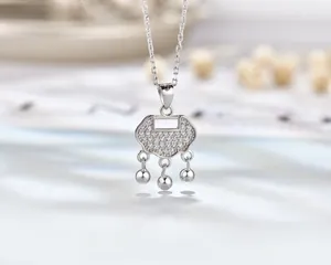 Macro detail of S925 sterling silver longevity lock pendant with sparkling diamonds