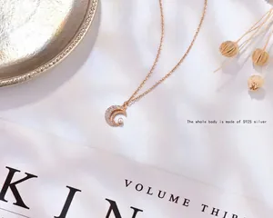Elegant s925 silver crescent moon necklace with small crystals and a white pearl