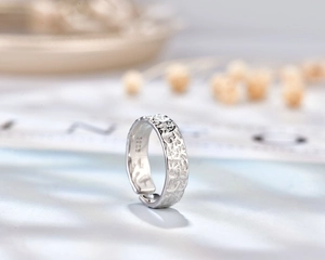 Close-up of S925 sterling silver hallmark on the inner band of a hammered texture ring