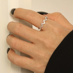 S925 sterling silver wave ring with micro-pave zircons worn on model's finger