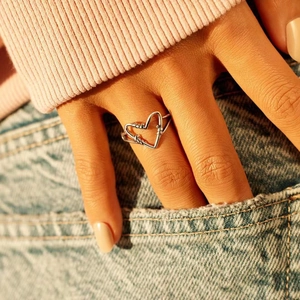 Minimalist S925 sterling silver heart ring with carabiner design on a female hand