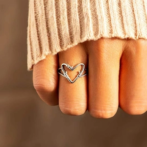 Minimalist S925 sterling silver open heart ring shown on model for a modern fashion look