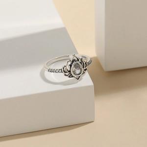 Minimalist 925 sterling silver lotus ring with pear-shaped zircon and pave stones
