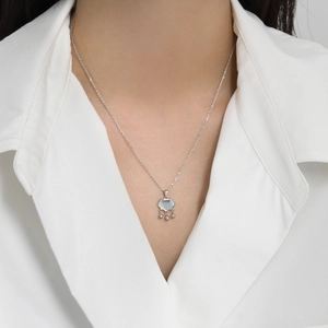 S925 sterling silver Ruyi lock necklace with mother of pearl on a white shirt