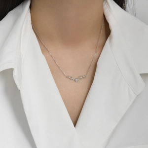 Elegant s925 silver reindeer antler necklace with a teardrop zircon on a model