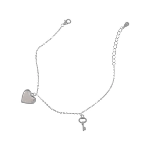 Detail of S925 sterling silver lobster clasp with adjustable chain and heart key charms