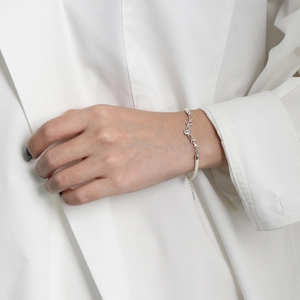 Minimalist S925 silver deer antler bracelet with white braided rope and adjustable chain