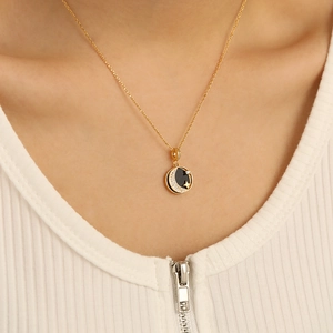 Close-up of S925 silver gold necklace featuring a crescent moon and star shell pendant