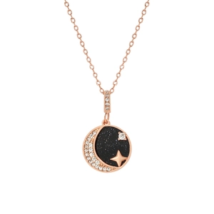 Detail of rose gold moon and star necklace pendant with blue sandstone and zircon inlay