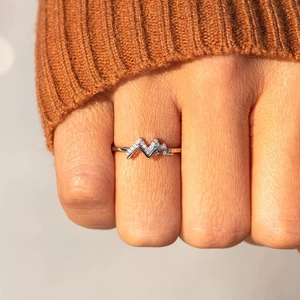 Minimalist S925 sterling silver mountain ring with zircon stones worn on the finger