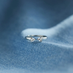 Detailed close-up of S925 silver open ring with triangle-cut cubic zirconia crystals