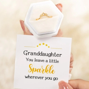 Golden crown star ring with zircons in a gift box with a card for granddaughter