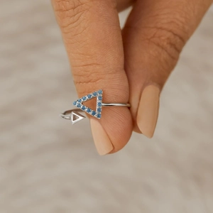 Minimalist S925 sterling silver triangle ring with blue cubic zirconia on hand