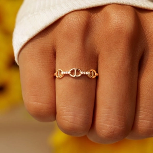 Rose gold chain link ring with sparkling micro-pave diamonds on a minimalist band