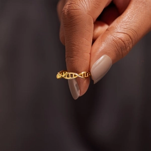 Minimalist golden DNA double helix ring featuring exquisite hollow structure on hand