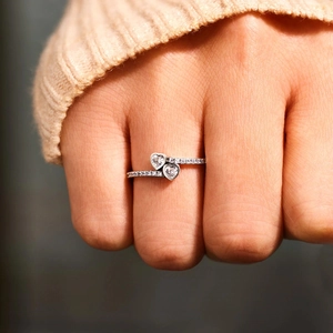 Elegant S925 sterling silver double heart ring with sparkling cubic zirconia on finger