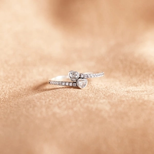 Macro view of S925 sterling silver ring with double heart-cut zircon stones