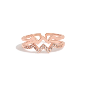 Macro shot of rose gold double-layer wave ring with micro-set cubic zirconia stones