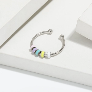 Detailed macro view of S925 silver fidget ring with five colorful enamel spinning beads