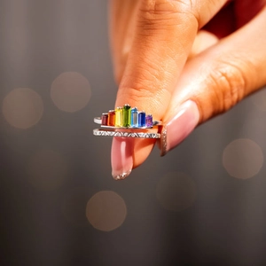 Macro detail of S925 silver double ring with rainbow gradient cubic zirconia stones