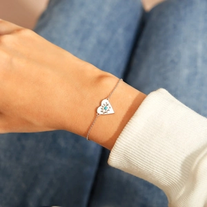 S925 sterling silver heart evil eye bracelet on wrist with turquoise stone detail